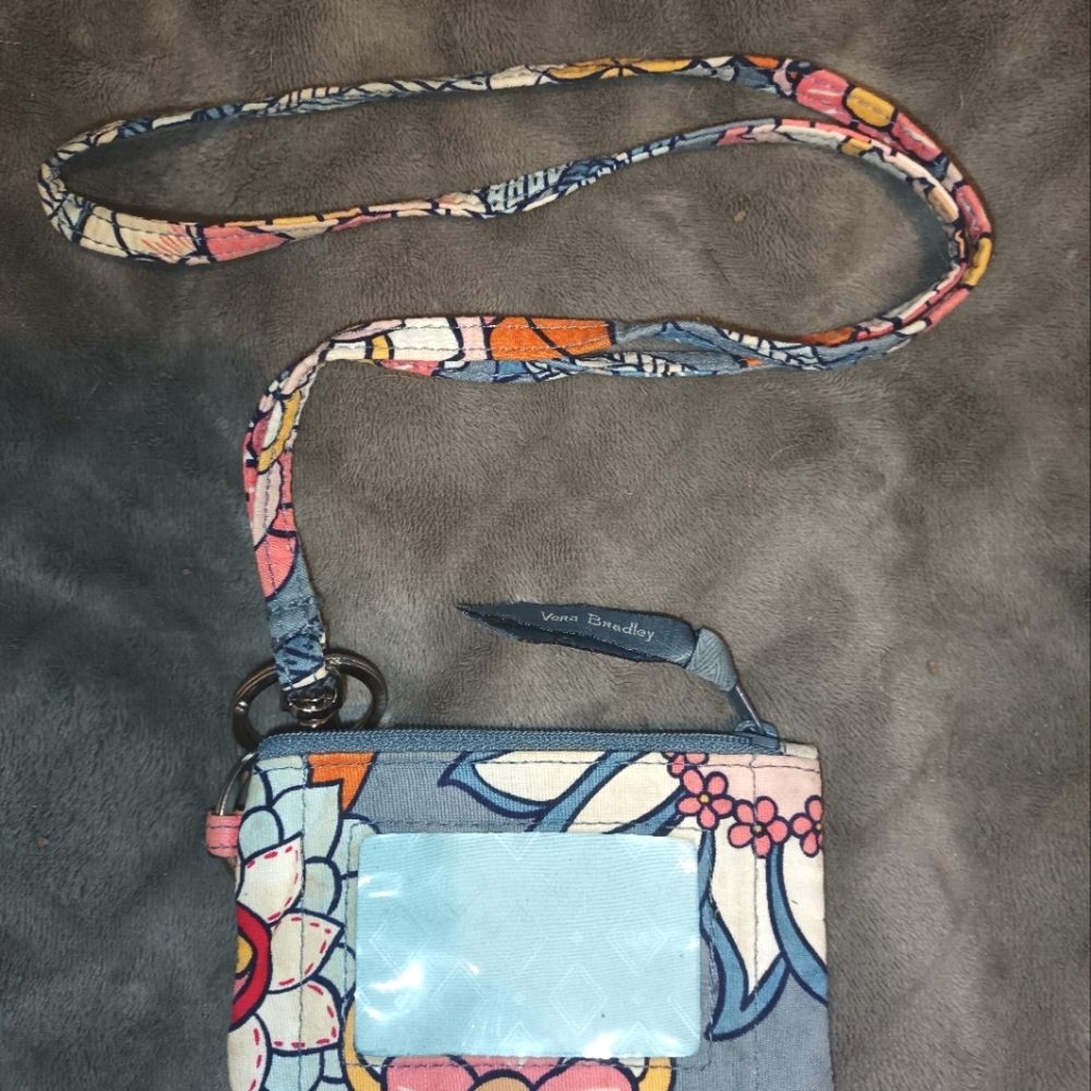 Vera Bradley floral coin purse with id window with matching lanyard.